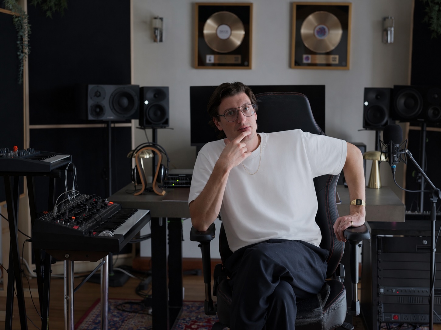 Alex Braithwaite (Sub-Human), music producer, mix engineer and trainer in his mixing studio with gold records