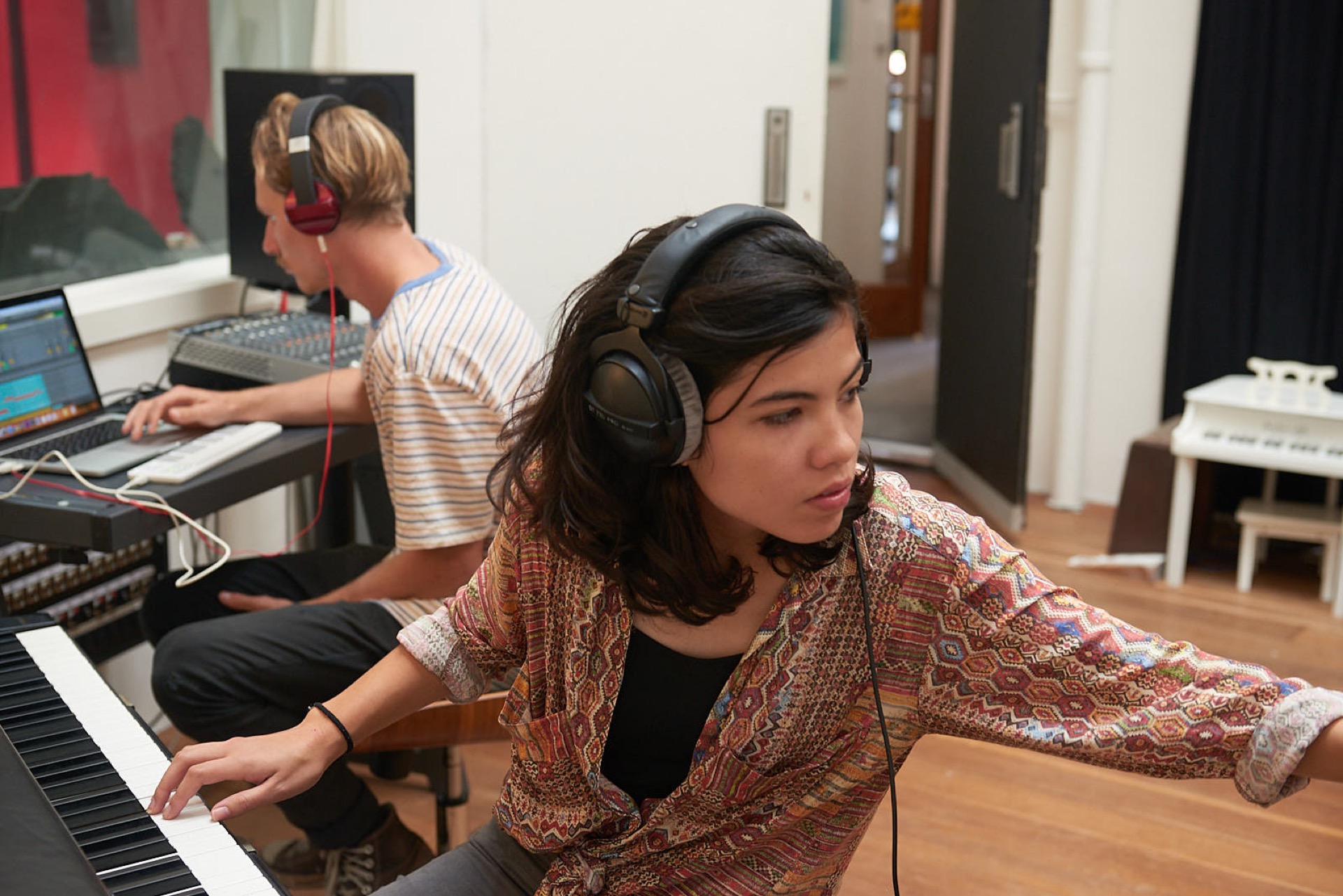 students in a music studio recording instruments into ableton live