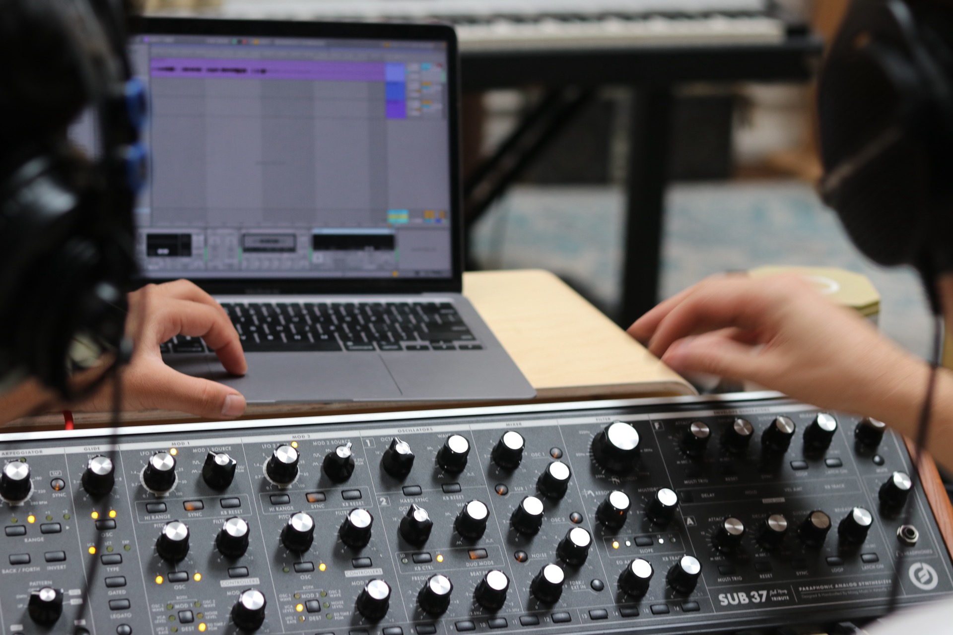 students recording a moog sub 27 into ableton live during a sound design class