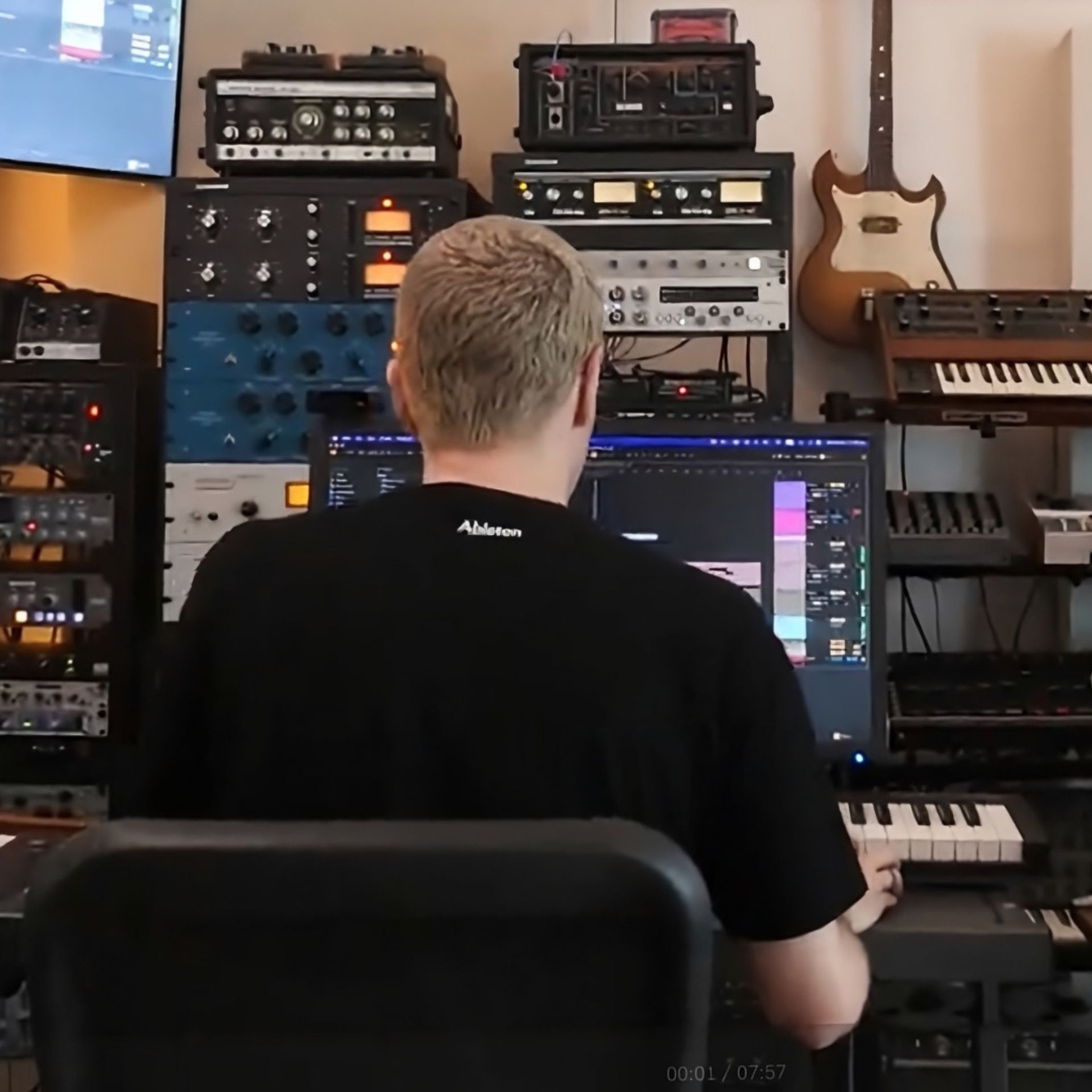 Music producer in the studio at Liveschool Sydney mixing and mastering a track Ableton Live