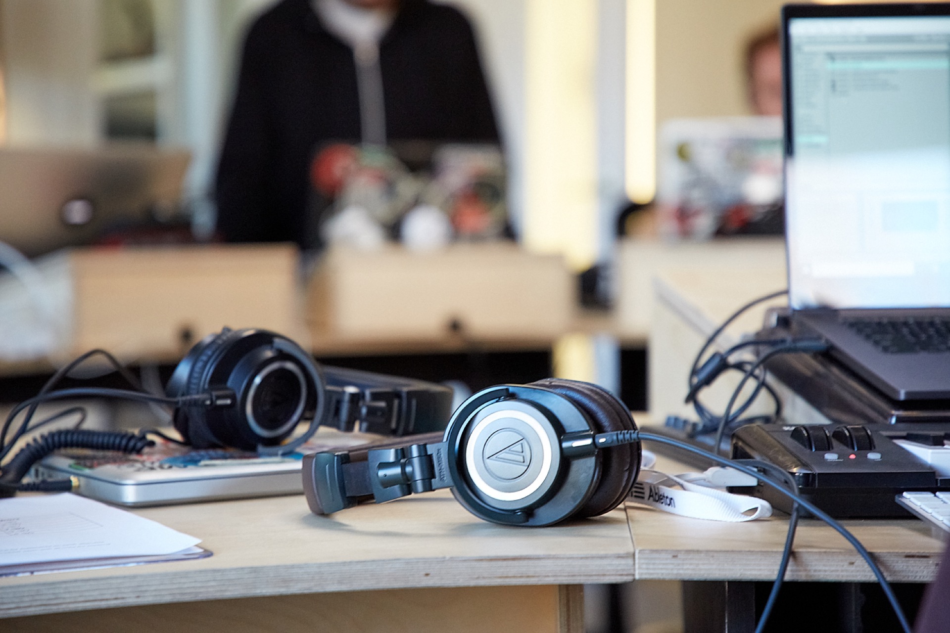 headphones on a table during a class break in a music studio