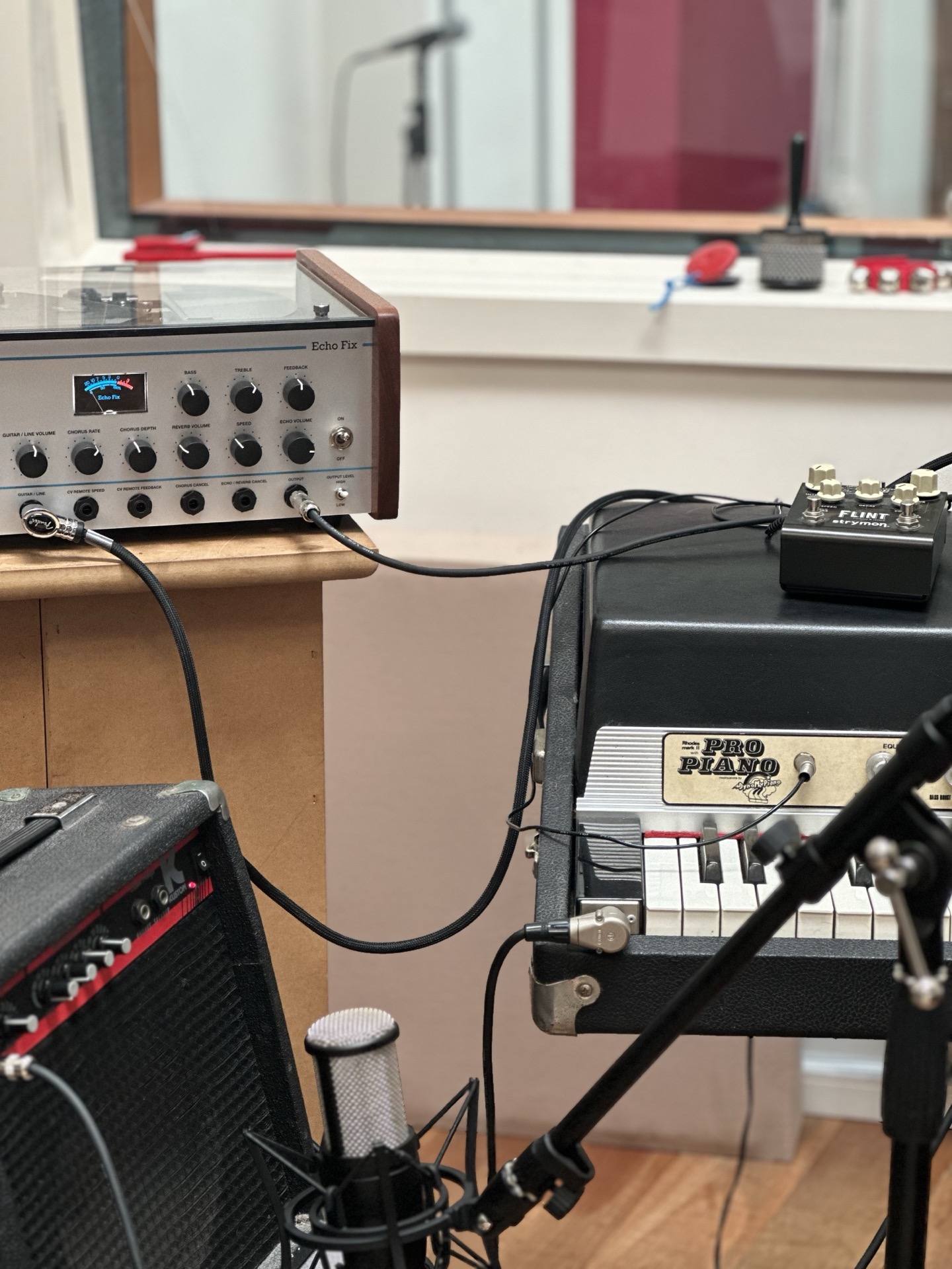 Recording a Rhodes piano through an Echo Fix Chorus Echo tape machine and Strymon Flint tremolo reverb with a vintage microphone