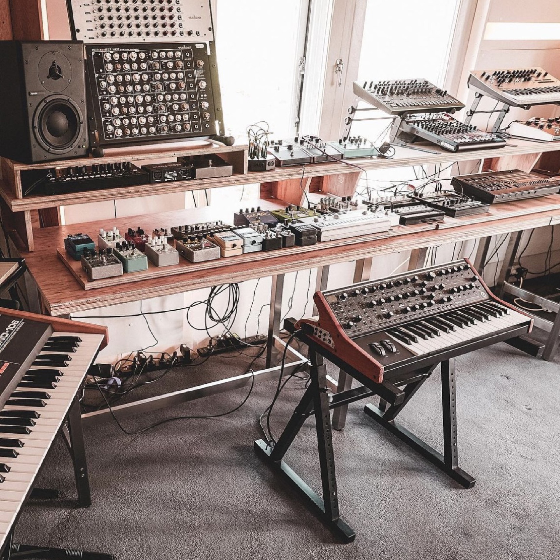 Collection of hardware synthesisers, drum machines and effects pedals