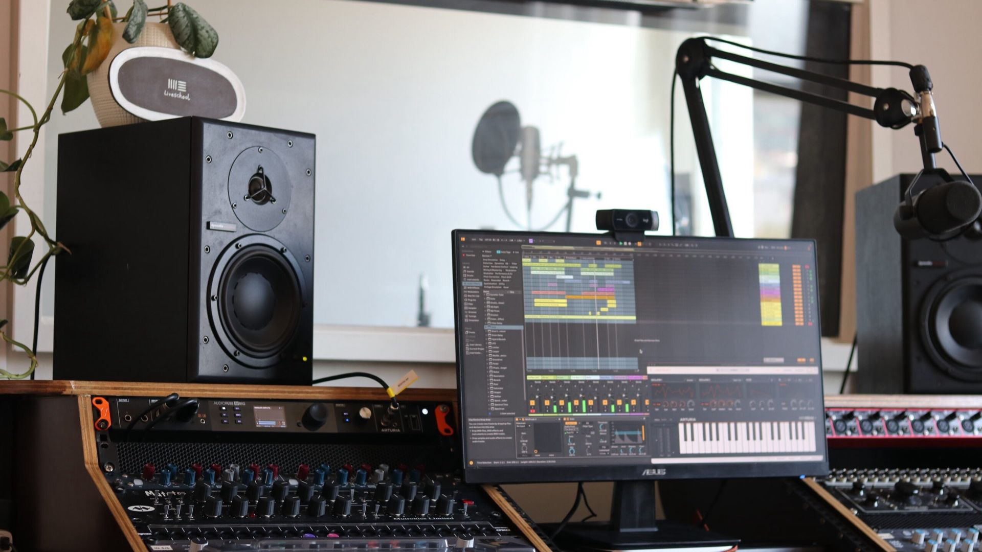 music production studio with vocal booth and outboard processing at Liveschool Sydney