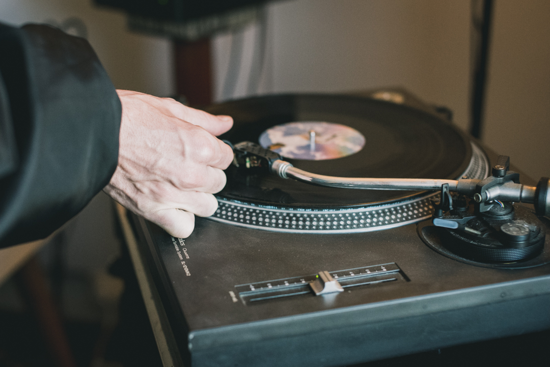 music producer playing their release on vinyl