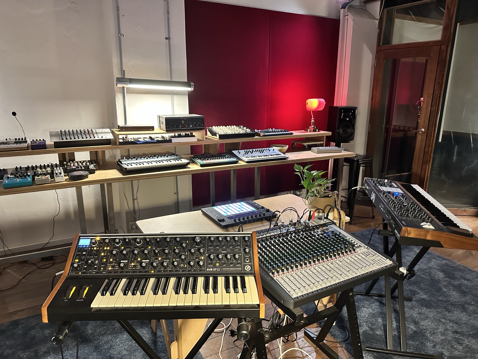 Synthesisers and a mixing desk set up for sampling and collaboration