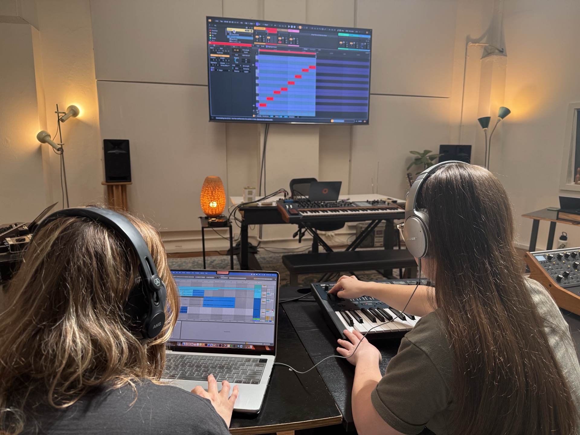 students producing music in in Liveschool's studio classroom